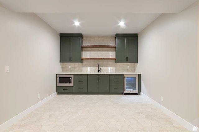 514 S 1450 W, Farmington, UT 84025 - kitchen with beverage cooler, green cabinetry, a sink, stainless steel microwave, and light countertops