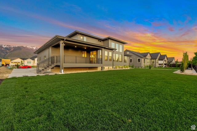 514 S 1450 W, Farmington, UT 84025 - back of house at dusk featuring a yard