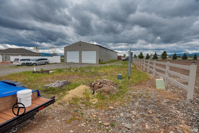 249 E 1800 N, Beaver, UT 84713 - view of yard featuring fence, a detached garage, and an outdoor structure