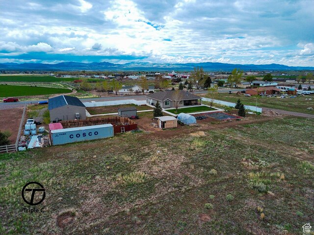 249 E 1800 N, Beaver, UT 84713 - aerial view of property and surrounding area featuring a mountain backdrop