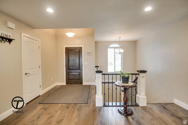 249 E 1800 N, Beaver, UT 84713 - foyer entrance featuring wood finished floors, baseboards, recessed lighting, and a chandelier