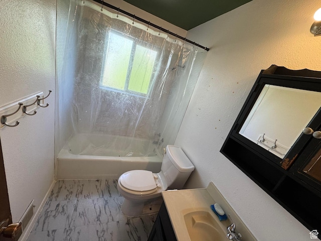bathroom featuring marble finish flooring, toilet, shower / bath combo, vanity, and baseboards