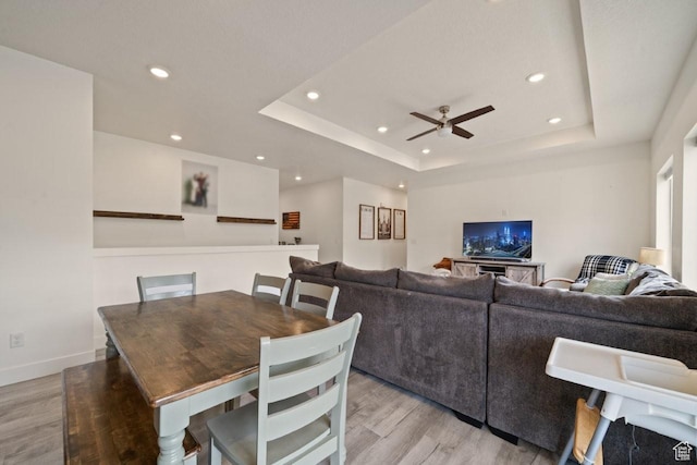 12735 W Kimberly Cir, Tremonton, UT 84337 - dining room featuring recessed lighting, a raised ceiling, a ceiling fan, and light wood-style floors