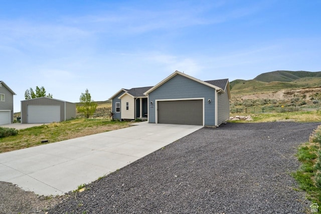 12735 W Kimberly Cir, Tremonton, UT 84337 - single story home featuring concrete driveway, a mountain view, and a garage
