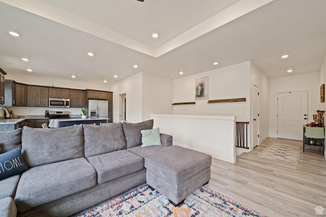 12735 W Kimberly Cir, Tremonton, UT 84337 - living area featuring light wood-style flooring, baseboards, and recessed lighting