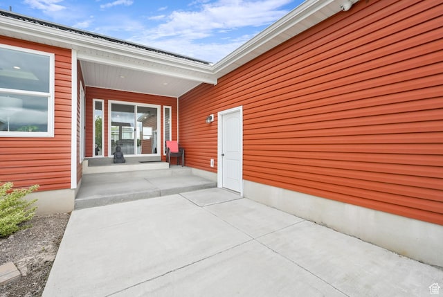 view of exterior entry featuring a porch