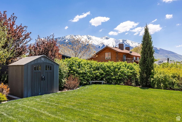 65 W Carnesecca Ct N, Mapleton, UT 84664 - view of yard featuring an outdoor structure, a mountain view, and a storage unit