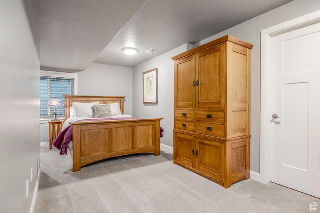 65 W Carnesecca Ct N, Mapleton, UT 84664 - bedroom featuring baseboards, light carpet, and a textured ceiling