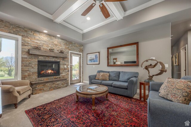 65 W Carnesecca Ct N, Mapleton, UT 84664 - living area with carpet, a ceiling fan, beam ceiling, a fireplace, and crown molding