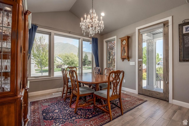 65 W Carnesecca Ct N, Mapleton, UT 84664 - dining room with vaulted ceiling, a chandelier, baseboards, and a healthy amount of sunlight