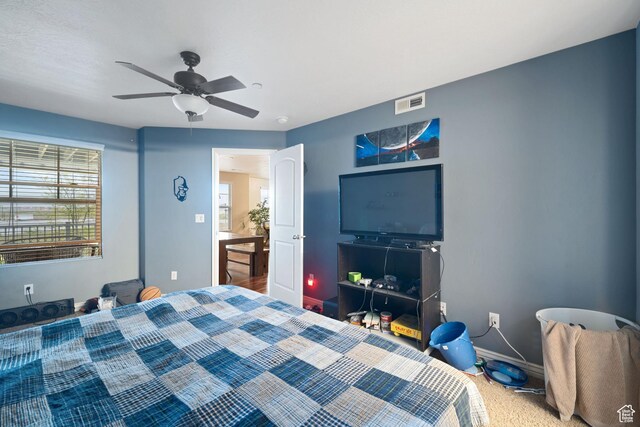 bedroom featuring visible vents, baseboards, and a ceiling fan