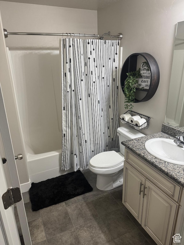 bathroom with toilet, vanity, and shower / bath combination with curtain