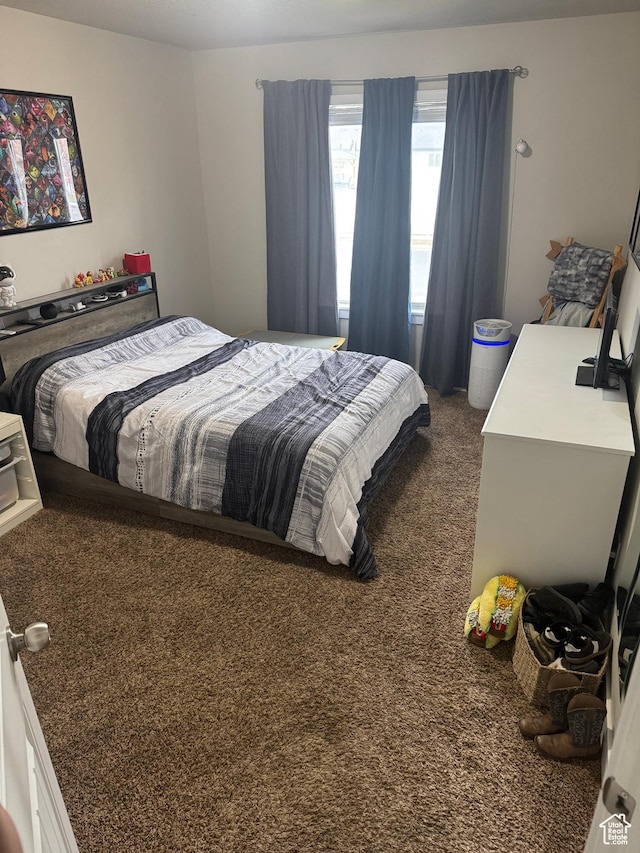 bedroom with dark carpet