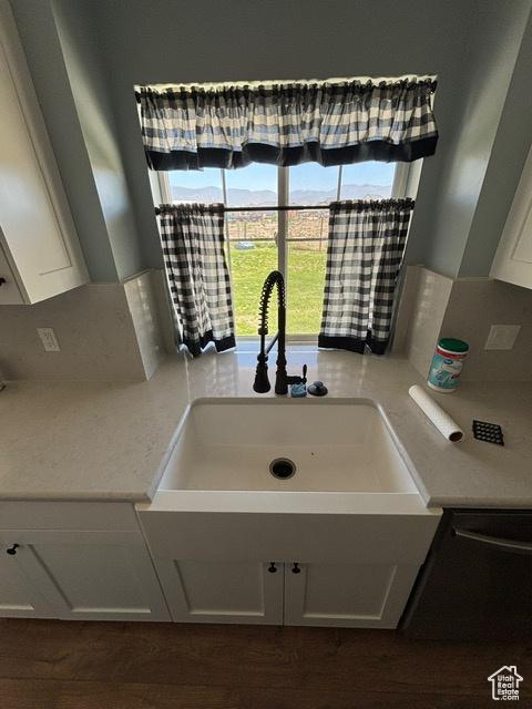 2577 W 5300 N Unit 11, Cedar City, UT 84721 - kitchen with a sink, light countertops, and white cabinetry