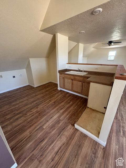 2577 W 5300 N Unit 11, Cedar City, UT 84721 - bathroom featuring wood finished floors, a textured ceiling, a ceiling fan, baseboards, and vanity
