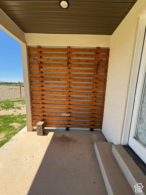 2577 W 5300 N Unit 11, Cedar City, UT 84721 - entrance to property with stucco siding and a balcony
