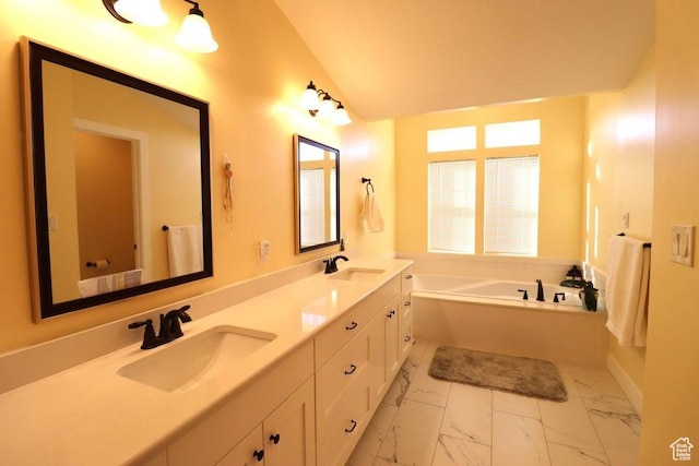 2577 W 5300 N Unit 11, Cedar City, UT 84721 - bathroom featuring marble look tile flooring, a bath, vaulted ceiling, and double vanity