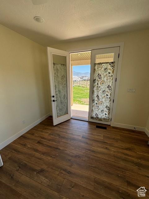 2577 W 5300 N Unit 11, Cedar City, UT 84721 - foyer entrance featuring dark wood-type flooring and baseboards
