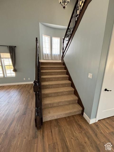 2577 W 5300 N Unit 11, Cedar City, UT 84721 - stairway featuring baseboards, plenty of natural light, wood finished floors, and a chandelier