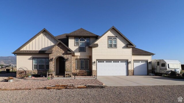 2577 W 5300 N Unit 11, Cedar City, UT 84721 - craftsman inspired home with stone siding, driveway, board and batten siding, an attached garage, and a shingled roof
