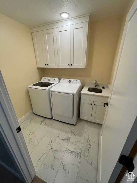 2577 W 5300 N Unit 11, Cedar City, UT 84721 - laundry room featuring cabinet space, separate washer and dryer, light marble finish floors, baseboards, and recessed lighting