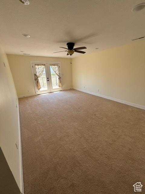 2577 W 5300 N Unit 11, Cedar City, UT 84721 - unfurnished room featuring french doors, ceiling fan, light colored carpet, and baseboards