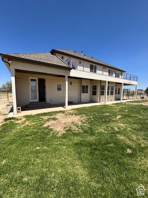 2577 W 5300 N Unit 11, Cedar City, UT 84721 - back of property with a patio, a yard, a balcony, and stucco siding