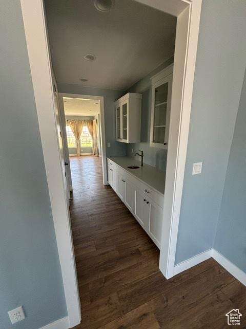 2577 W 5300 N Unit 11, Cedar City, UT 84721 - hall with baseboards, dark wood-type flooring, and a sink