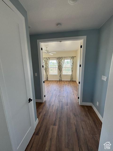 2577 W 5300 N Unit 11, Cedar City, UT 84721 - hallway featuring dark wood-type flooring and baseboards