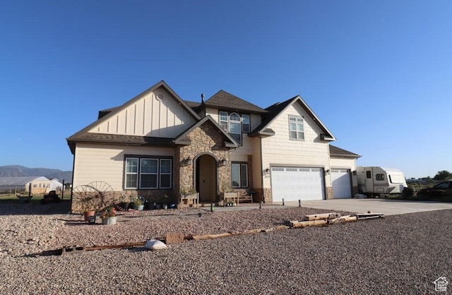 2577 W 5300 N Unit 11, Cedar City, UT 84721 - craftsman-style home featuring stone siding, a garage, board and batten siding, and concrete driveway