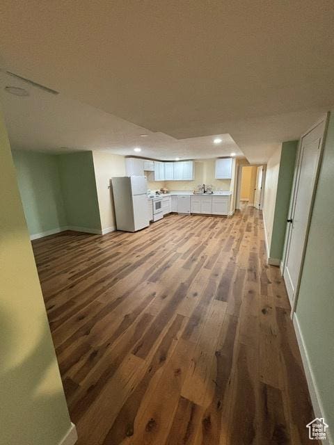 2577 W 5300 N Unit 11, Cedar City, UT 84721 - unfurnished living room featuring dark wood-style floors, baseboards, and recessed lighting