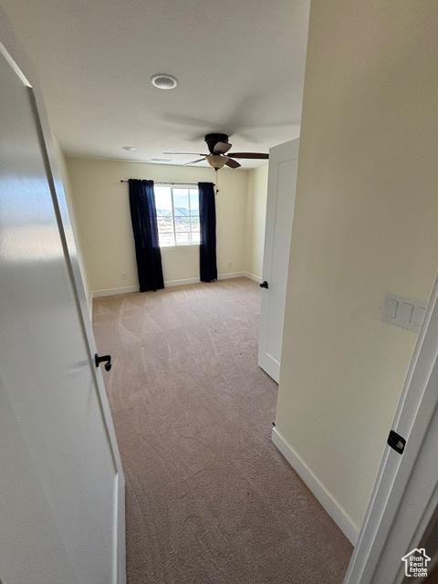 2577 W 5300 N Unit 11, Cedar City, UT 84721 - hall featuring light colored carpet and baseboards