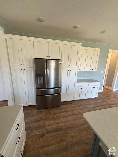 2577 W 5300 N Unit 11, Cedar City, UT 84721 - kitchen with stainless steel fridge, dark wood-style flooring, white cabinetry, light countertops, and baseboards