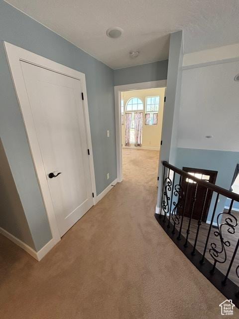 2577 W 5300 N Unit 11, Cedar City, UT 84721 - hallway with carpet flooring, an upstairs landing, and baseboards