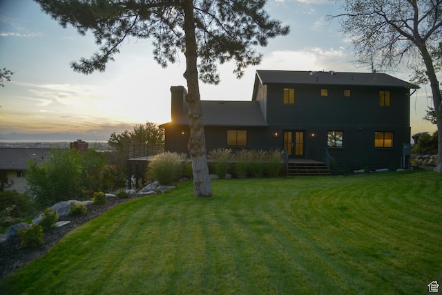 1040 N Oakmont Ln, Provo, UT 84604 - back of house at dusk with a lawn, french doors, and a wooden deck