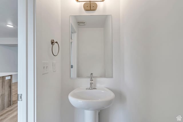 1679 S 1355 E Unit A21, Ogden, UT 84404 - bathroom with wood finished floors and a sink