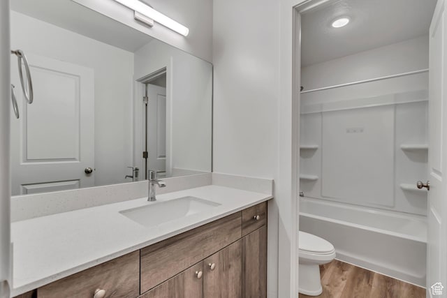 1679 S 1355 E Unit A21, Ogden, UT 84404 - bathroom featuring vanity, wood finished floors, toilet, and shower / tub combination