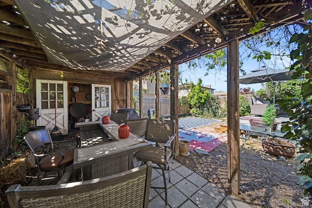 view of patio featuring a fenced backyard and a pergola