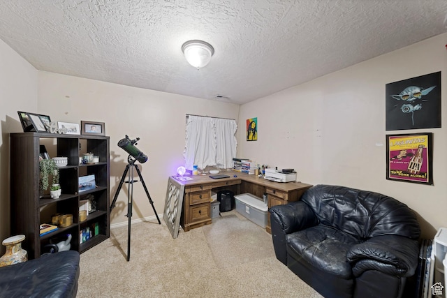 office featuring carpet floors and a textured ceiling
