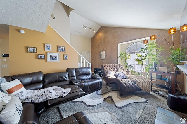 living area with vaulted ceiling, stairway, and carpet