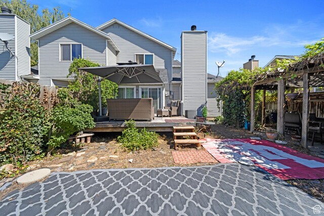 rear view of house with a deck, fence, a pergola, an outdoor hangout area, and a patio area