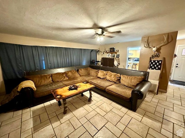 105 S 300 E, Enterprise, UT 84725 - living area with ceiling fan, a textured ceiling, and stone finish floor