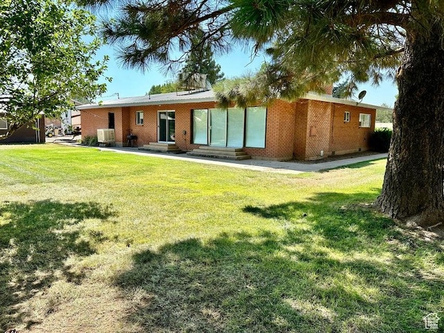 105 S 300 E, Enterprise, UT 84725 - rear view of house with entry steps and a lawn
