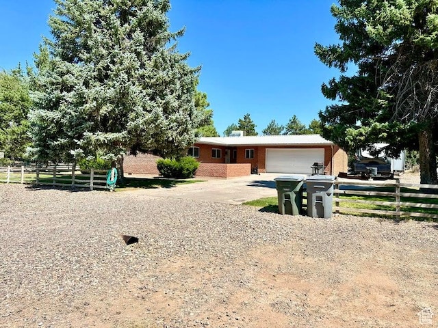 105 S 300 E, Enterprise, UT 84725 - ranch-style home featuring concrete driveway, brick siding, fence, and an attached garage