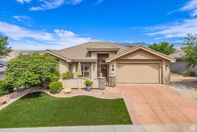 view of front facade with fence, a garage, stucco siding, and concrete driveway