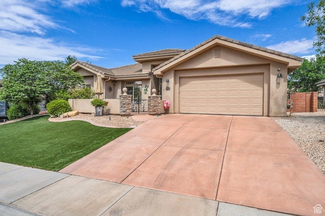 3322 W Bonita, Hurricane, UT 84737 - view of front of house with driveway, a tile roof, a garage, stucco siding, and a front yard