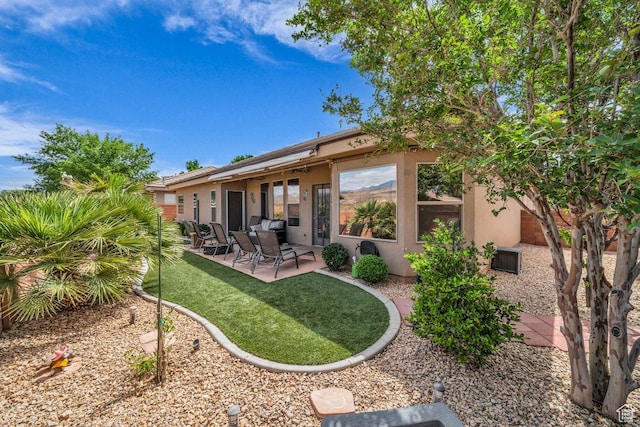 3322 W Bonita, Hurricane, UT 84737 - back of house featuring a yard, stucco siding, and a patio area