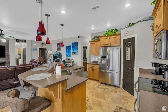3322 W Bonita, Hurricane, UT 84737 - kitchen with visible vents, a sink, open floor plan, dark countertops, and appliances with stainless steel finishes