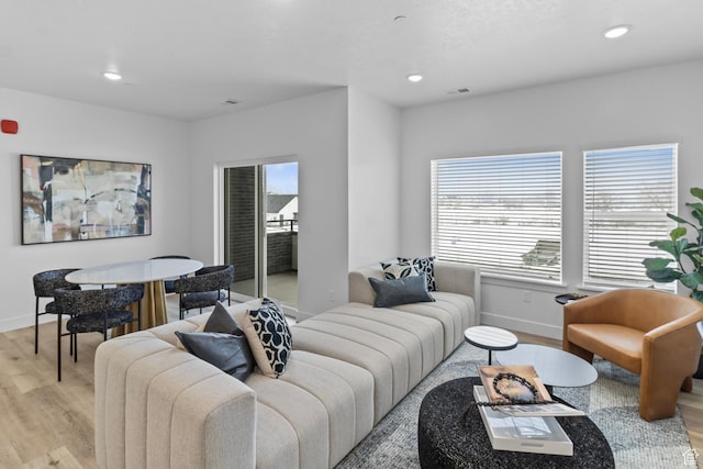 3085 S 225 W Unit 204, Nibley, UT 84321 - living room with baseboards, light wood-style flooring, and visible vents