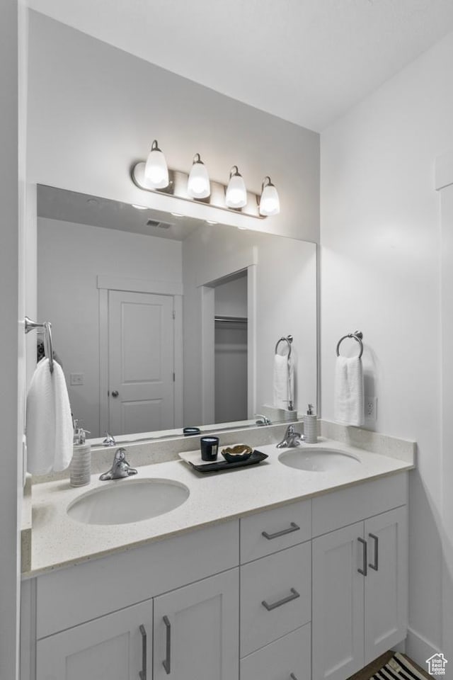 3085 S 225 W Unit 204, Nibley, UT 84321 - full bath featuring a sink, double vanity, and visible vents